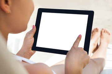 Woman Using Digital Tablet At Resort