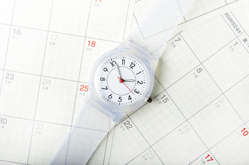 カレンダーと腕時計のスケジュールのイメージ