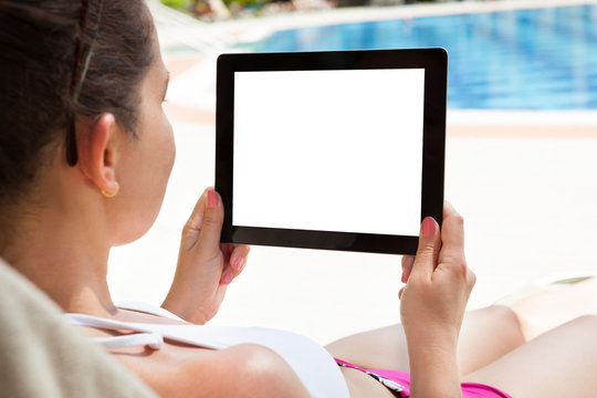 Woman Using Digital Tablet At Resort