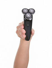 A electric razor in a hand on white background
