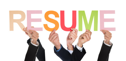 Group Of Hands Holding The Word Resume