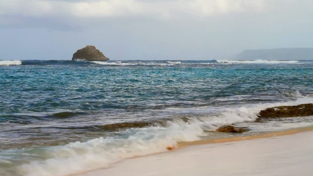 Sea waves running on coast. Anse de Shatto, Guadeloupe