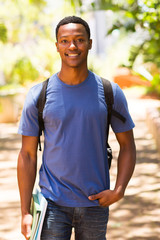 male african college student walking on campus