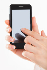 Business woman with young hands and beautiful nails using mobile