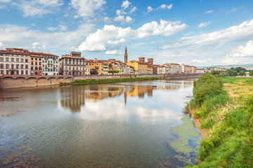 View of Ponte Vecchio with reflections in Arno River, Florence,