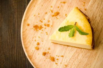 New York cheese cake on wooden plate