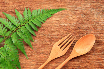 Wooden spoon and fork on table