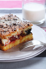 Homemade pie with jam and glass of milk