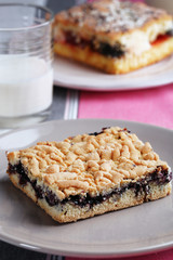Homemade pies with jam and glass of milk