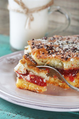 Homemade pie with jam, chocolate and glass of milk