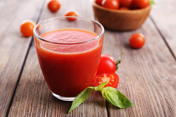 Tomato juice in glass with basil  and tomatoes cherry