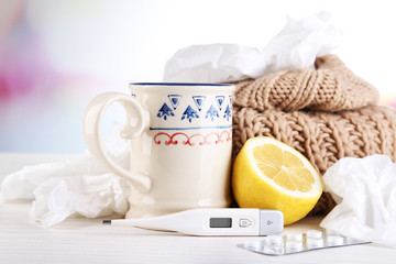 Hot tea for colds, pills and handkerchiefs