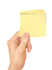 business concept: hand holding a sticky note