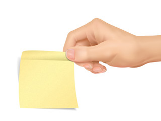 business concept: hand holding a sticky note