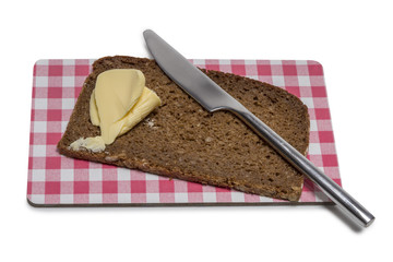 Bread with butter on a board