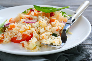 Tasty rice with vegetables on a plate