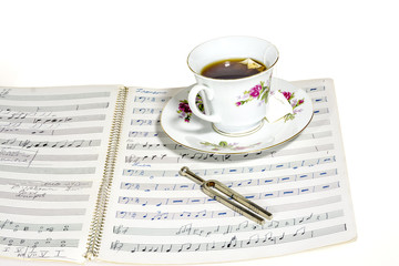 Tea on a music notebook