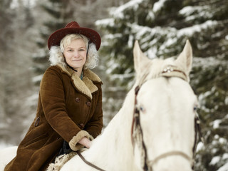 White horse and riding woman