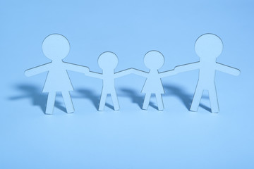 Paper family on blue background