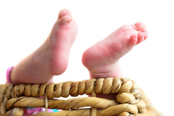 Small feet of newborn baby
