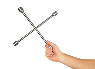 Cross wrench in male hand isolated on white
