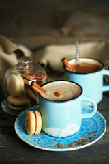 Beautiful composition with tasty cappuccino on wooden table
