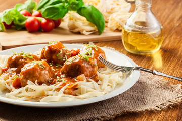 Pasta fettuccine and meatballs with tomato sauce