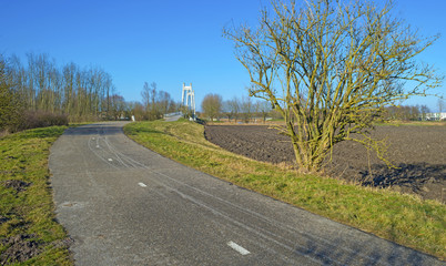 Bicycle path towards a bridge in winter