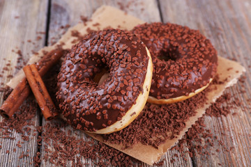 Delicious donuts with icing and chocolate crumb