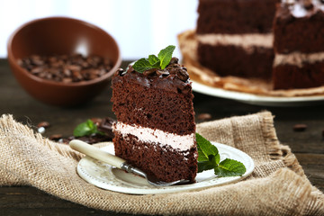 Delicious chocolate cake on table close-up