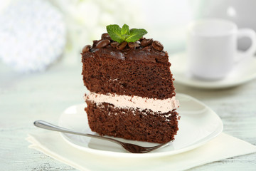 Delicious chocolate cake on table on light background