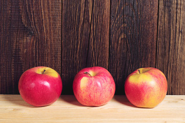 Three red apples