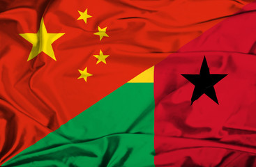 Waving flag of Guinea Bissau and China