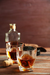Whiskey on wooden background