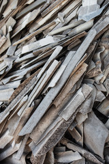 Pile of the old and damaged wavy roofing slates