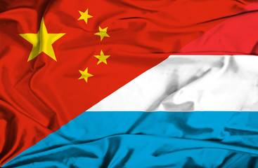 Waving flag of Luxembourg and China