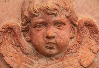 Fototapeta na wymiar decorative relief of angel in terracotta