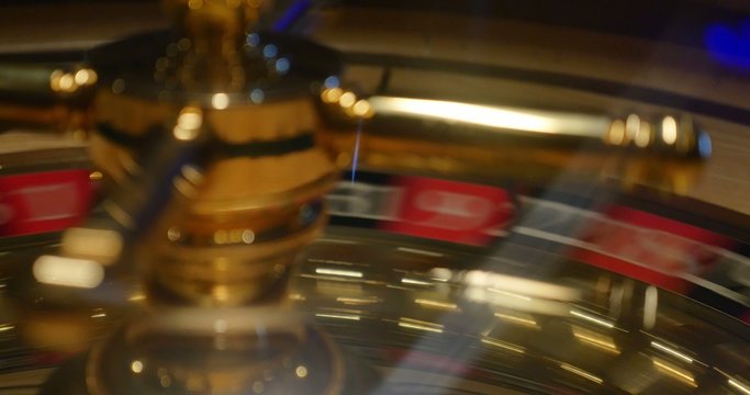 The luck is uncertain / A 4K close shot of a casino roulette in motion...