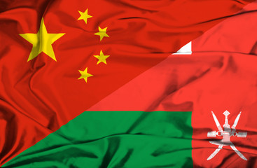 Waving flag of Oman and China