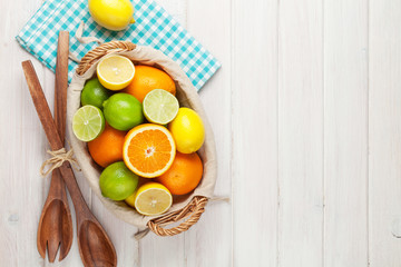 Citrus fruits in basket. Oranges, limes and lemons