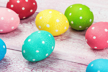 Obraz na płótnie Canvas colored Easter eggs on wooden background