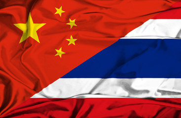 Waving flag of Thailand and China