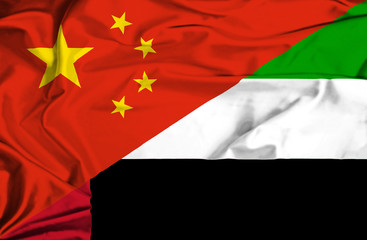 Waving flag of United Arab Emirates and China