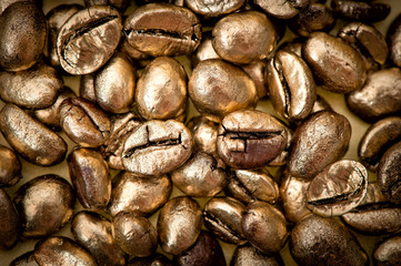 golden coffee beans. background. texture