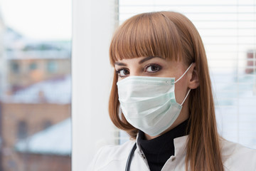 Beautiful female doctor wearing surgical mask