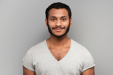 Obraz premium Calm mixed race man looking at camera