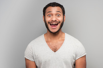 Mixed race man looking at camera cheerfully