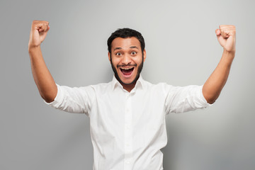 Fototapeta premium Young mixed race man cheerfully smiling