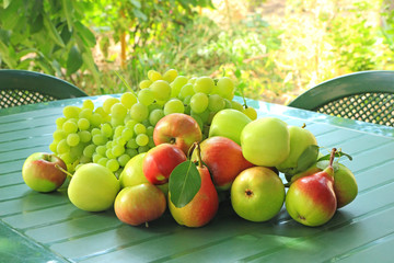 Grapes, apples and pears on a table