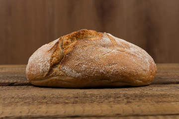 white bread over wooden background